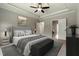 Staged main bedroom featuring trey ceiling, ceiling fan, and neutral carpet at 550 Spring Flowers Dr, Cameron, NC 28326