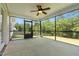 Inviting screened porch with ceiling fan and view of the backyard at 550 Spring Flowers Dr, Cameron, NC 28326