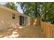 Newly constructed back deck overlooking fenced in yard with mature trees at 5911 Westcreek Pl, Raleigh, NC 27606