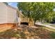 Wooden back deck elevated above the yard with steps to ground level at 5911 Westcreek Pl, Raleigh, NC 27606