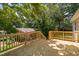 Spacious wooden deck overlooking yard with mature trees and neighborhood views at 5911 Westcreek Pl, Raleigh, NC 27606