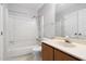 Bathroom featuring a shower/tub combo, single sink vanity, and large mirror at 5911 Westcreek Pl, Raleigh, NC 27606