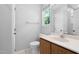 Bathroom featuring a single sink vanity, large mirror and natural light at 5911 Westcreek Pl, Raleigh, NC 27606