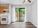 Dining area with modern flooring, ceiling fan, and sliding doors leading to the outdoor deck at 5911 Westcreek Pl, Raleigh, NC 27606