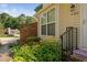 Lovely home exterior with a brick accent wall, lush flowerbeds, and a welcoming front entrance at 5911 Westcreek Pl, Raleigh, NC 27606