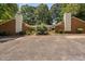 View of home exterior with twin brick chimneys and shared driveway at 5911 Westcreek Pl, Raleigh, NC 27606