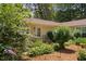 Inviting home exterior featuring well-maintained landscaping around the front door and entrance at 5911 Westcreek Pl, Raleigh, NC 27606