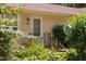 Charming home entrance with vibrant flowers and a cozy aesthetic, featuring a decorative birdhouse at 5911 Westcreek Pl, Raleigh, NC 27606