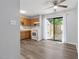 Open kitchen and dining area with wood cabinets and sliding glass door to the exterior at 5911 Westcreek Pl, Raleigh, NC 27606