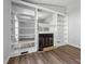 Bright and spacious living room features built-in bookshelves, fireplace, and modern flooring at 5911 Westcreek Pl, Raleigh, NC 27606