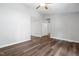 Open living room with modern flooring, neutral paint, and closet with extra storage space at 5911 Westcreek Pl, Raleigh, NC 27606