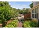 A well landscaped property with charming brick accents, located in a serene, tree-lined neighborhood at 5911 Westcreek Pl, Raleigh, NC 27606