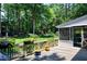 Back deck featuring wood flooring, flower boxes, and a view of the lush, green backyard at 608 Misty Isle Pl, Raleigh, NC 27615