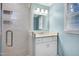 Bathroom with a glass shower door and tiled walls at 608 Misty Isle Pl, Raleigh, NC 27615