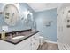 Modern bathroom with double vanity and a glass enclosed shower at 608 Misty Isle Pl, Raleigh, NC 27615