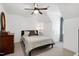 Cozy bedroom featuring neutral tones, ceiling fan, and comfortable queen sized bed at 608 Misty Isle Pl, Raleigh, NC 27615
