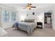 Cozy bedroom with a large window, ceiling fan, and serene decor at 608 Misty Isle Pl, Raleigh, NC 27615