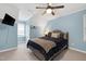 Inviting bedroom featuring blue accent walls and carpeted floor at 608 Misty Isle Pl, Raleigh, NC 27615