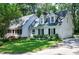 Charming home with manicured lawn, dormer windows, and an attached garage at 608 Misty Isle Pl, Raleigh, NC 27615