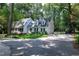 Charming home with a manicured lawn, beautiful landscaping and an attached two-car garage at 608 Misty Isle Pl, Raleigh, NC 27615