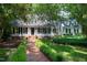 Charming two-story home with a brick walkway and well-manicured landscaping, creating a welcoming curb appeal at 608 Misty Isle Pl, Raleigh, NC 27615