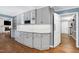 Kitchen featuring gray cabinets, granite countertops, and subway tile backsplash at 608 Misty Isle Pl, Raleigh, NC 27615