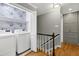 Convenient laundry area with washer, dryer, shelving and storage solutions at 608 Misty Isle Pl, Raleigh, NC 27615