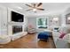 Bright living room featuring a fireplace, hardwood floors, and comfortable seating at 608 Misty Isle Pl, Raleigh, NC 27615