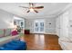 Living room with hardwood floors, neutral paint, and access to the kitchen at 608 Misty Isle Pl, Raleigh, NC 27615