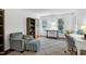 Well-lit office featuring a cozy chair, bookshelf, and desk with natural light, perfect for a productive workspace at 608 Misty Isle Pl, Raleigh, NC 27615