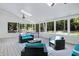 Relaxing screened porch features ample seating and outdoor living space at 608 Misty Isle Pl, Raleigh, NC 27615