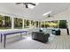 Screened porch with comfortable seating and views of the backyard at 608 Misty Isle Pl, Raleigh, NC 27615