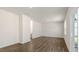 Open living room featuring hardwood flooring, sliding glass doors and plenty of natural light at 62 Cheyenne Dr, Clayton, NC 27520