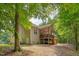 Exterior view of home, showcasing a large backyard with a covered deck at 62 Mountain Laurel Ln, Four Oaks, NC 27524