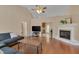 Spacious living room with wood floors, vaulted ceiling, fireplace and ample natural light at 62 Mountain Laurel Ln, Four Oaks, NC 27524