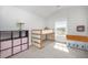 This bedroom includes a loft bed, toys, storage, and natural light from the window at 645 Longstanton Ave, Zebulon, NC 27597