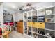 Spacious walk-in closet with custom shelving and storage solutions for clothes and accessories at 645 Longstanton Ave, Zebulon, NC 27597