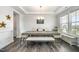 Elegant dining room featuring hardwood floors, a modern chandelier, and seating for eight at 645 Longstanton Ave, Zebulon, NC 27597