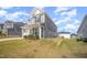 Well-maintained home with a manicured lawn and inviting porch, showcasing its charming curb appeal on a sunny day at 645 Longstanton Ave, Zebulon, NC 27597