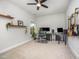 Bright home office space with a window, modern desk, and a ceiling fan at 645 Longstanton Ave, Zebulon, NC 27597