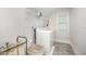 Functional laundry room with appliances, shelving, and ample space for laundry tasks at 645 Longstanton Ave, Zebulon, NC 27597