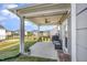 Covered patio with a ceiling fan and views of the backyard and surrounding neighborhood at 645 Longstanton Ave, Zebulon, NC 27597