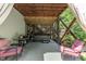 Cozy backyard patio featuring a hot tub, seating area and lush landscaping at 6509 Conaway Ct, Wake Forest, NC 27587