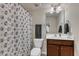 Cozy bathroom featuring a vanity with storage, toilet, and shower with patterned curtain at 6509 Conaway Ct, Wake Forest, NC 27587