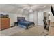 Comfortable bedroom featuring a bed, dresser, and a connecting bathroom at 6509 Conaway Ct, Wake Forest, NC 27587