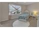 Charming bedroom featuring a white bed, decorative sheer curtains, plush rug and a window view of the landscape at 6509 Conaway Ct, Wake Forest, NC 27587
