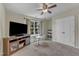 Spacious bonus room featuring a ceiling fan, a window view and a television with media center at 6509 Conaway Ct, Wake Forest, NC 27587
