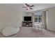 Large bonus room featuring a ceiling fan, TV, comfortable bean bag chair, and a window bringing in natural light at 6509 Conaway Ct, Wake Forest, NC 27587