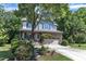 Charming two-story home featuring stone accents, a covered porch, and a well-manicured front yard at 6509 Conaway Ct, Wake Forest, NC 27587