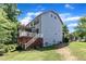 Exterior of the home with an attached deck and screened in porch, with lush backyard at 6509 Conaway Ct, Wake Forest, NC 27587